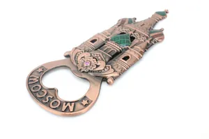 Close-up of bronze St. Basil's Cathedral bottle opener with Moscow engraving