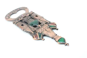Detailed macro view of vintage bronze Moscow souvenir bottle opener with colorful enamel