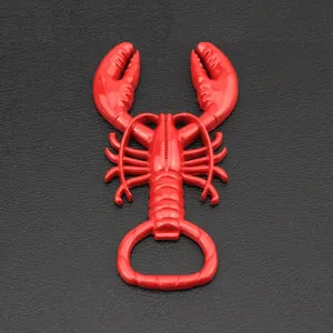 Macro shot of red lobster bottle opener on black leather surface showing fine details