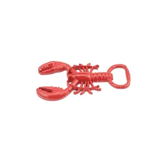 Creative red lobster-shaped metal bottle opener with a polished finish on grey background
