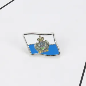 Detail shot of San Marino flag enamel pin with silver metal base and vibrant colors