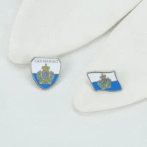 Macro shot of San Marino flag and shield lapel pins crafted from polished zinc alloy