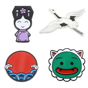 Set of four vintage style enamel pins featuring crane, sun, and cartoon girl motifs