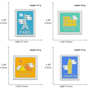 Detail view of stamp-style enamel pins showing sizes and weights of world landmarks