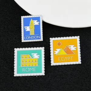 Stamp style enamel pins set featuring London, Rome, and Egypt landmarks on black texture