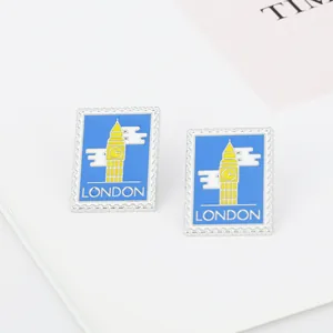 Detail of blue enamel London Big Ben stamp pins with distinct jagged edges and white lettering