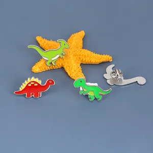 Cute cartoon dinosaur enamel pin set with colorful stegosaurus and T-Rex badges