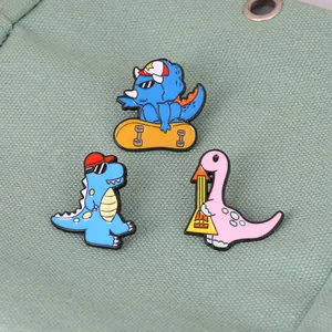 Three cute cartoon dinosaur enamel pins on green canvas for backpack accessory decoration