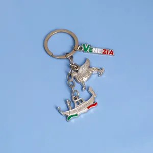 Venice souvenir keychain with metal charms of Winged Lion and Gondola in Italian flag colors
