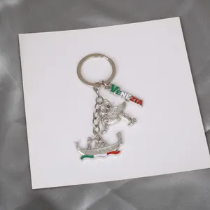 Detailed view of silver Venice souvenir keychain with San Marco lion and gondola charms
