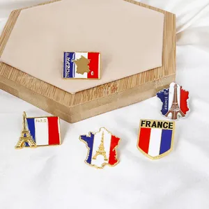5-piece set of Paris Eiffel Tower enamel pins with French flag colors on silk background