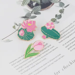 Elegant floral enamel pin set featuring pink lotus, cactus, and tulip designs for suits