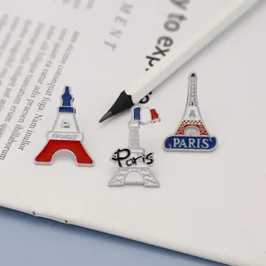 Enamel Eiffel Tower pins with French flag colors and Paris text in a three-piece set