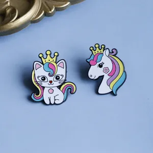 Cute enamel pins set with rainbow cartoon cat and unicorn wearing golden crowns