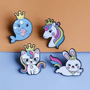 Set of four cute enamel pins featuring a rainbow whale, unicorn, cat, and rabbit designs
