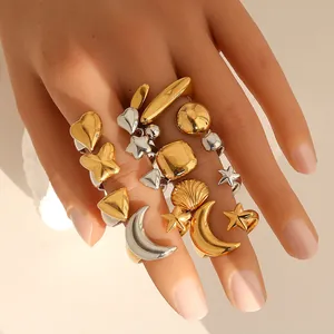 Chunky mixed gold and silver stainless steel rings with moon, star and shell charms