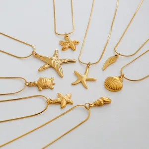 Detail of diverse gold plated ocean themed necklaces including starfish and turtle charms