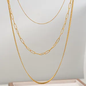 Three-layer layered gold necklaces featuring snake, paperclip, and box chain styles