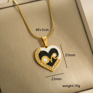 Detail of 14k gold plated heart pendant with 'Love' text and size 40+5cm specs