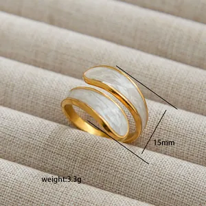 Detail view of 15mm gold adjustable ring with white marble enamel and 3.3g weight info