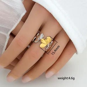 Detail view of gold and silver flower petal ring with 15.4mm diameter size on model hand