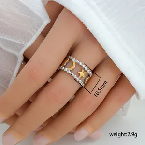 Detail view showing 10.5mm width and 2.9g weight of the star and moon open ring