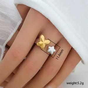 Detail of gold butterfly and silver star open ring showing dimensions and 5.2g weight