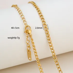 Macro detail of 18K gold plated stainless steel curb chain with lobster clasp and tag