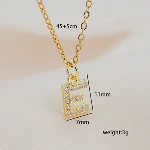 Macro detail of gold letter E pendant necklace with cubic zirconia and dimensions