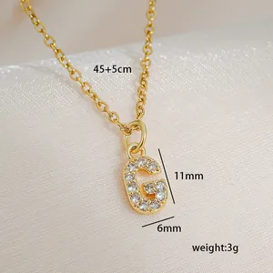 Detailed view of gold square pendant necklace with paved zircon letter G and measurements
