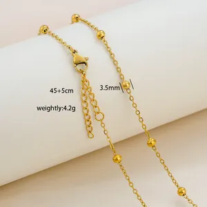Detail of 18K gold-plated beaded chain necklace with lobster clasp and size labels