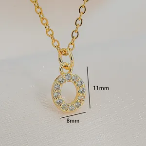 Macro shot of gold zircon letter pendant measuring 11mm in height and 8mm in width