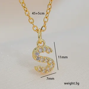 Detailed view of a gold zircon-studded letter S necklace with dimensions and weight