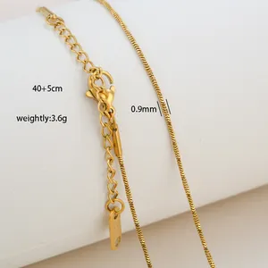 Detail of gold snake chain with dimensions 40+5cm length and 0.9mm width in stainless steel