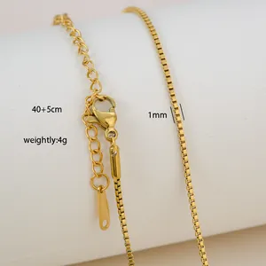 Detail of 1mm gold-plated stainless steel box chain necklace with lobster clasp and extension