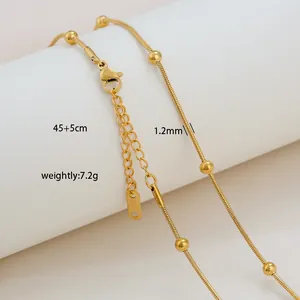 Detail of 18K gold plated stainless steel snake chain with small round beads and lobster clasp