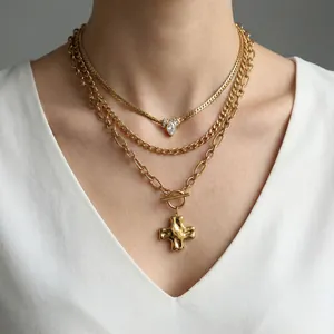 Three-layer gold stainless steel necklace set with cross pendant and crystal accents