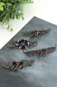Close-up detail of vintage gun-black metal hair clips with grey rhinestones and gems