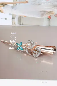 Detail of teal crystal butterfly hair clip with rhinestones on rose gold alloy base