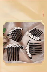 Detailed view of elegant hair combs with faux pearls and rhinestones on satin