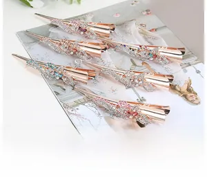 Close-up of alloy hair clips with rhinestone floral patterns in five elegant colors