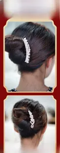 Detail view of pearl hair comb and rhinestone clip set on classic elegant updo
