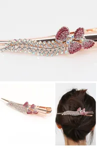 Macro detail of rose gold hair clip with pink rhinestones in butterfly and leaf design