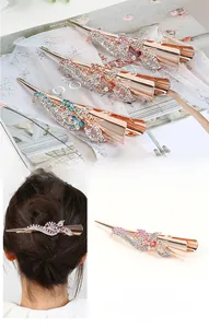 Detailed view of floral rhinestone alloy hair clips in various pastel color options