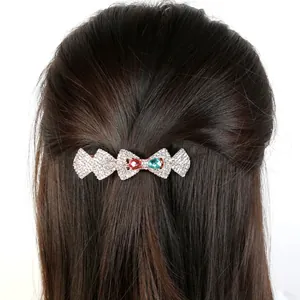 Sparkling crystal peacock hair clip with colorful gemstones on a metal spring barrette