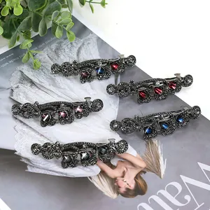 Set of vintage rhinestones hair clips with large colored gemstones and alloy base