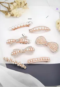 Detailed set of rose gold pearl hair clips with rhinestones in various elegant bow shapes