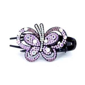 Pince à cheveux papillon élégante avec strass violets et blancs sur base noire