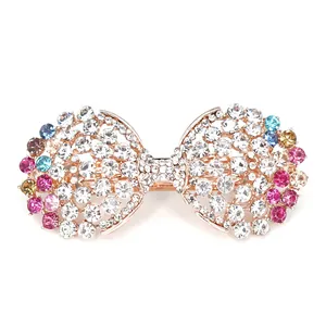 Eleganter Haarclip als Schleife mit bunten Kristallen und Strass auf Roségold-Basis