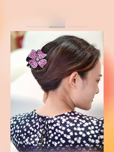 Detail view of pink crystal flower hair claw clip on model with sparkling rhinestones